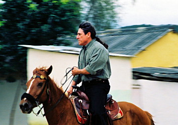 Jose Barreiro riding on a horse in Cuba